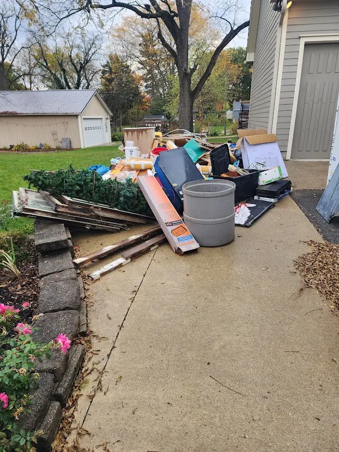 Dumpster being loaded with debris for 3 Yard Dumpster Rental in Long Prairie
